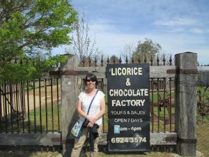 Kristie at the licorice factory, where you can sample dozens of chocolate-covered treats.